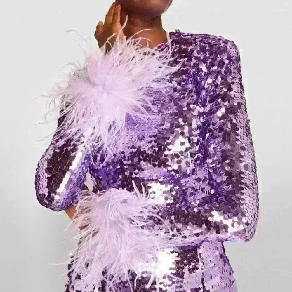 Veronique in Le Palace Purple Sequin Feather Dress